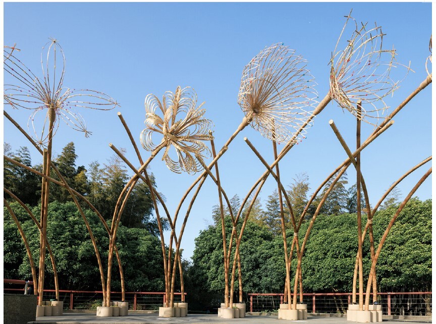 Woven bamboo canopy forms floral field bending over sunken urban plaza in shanghai